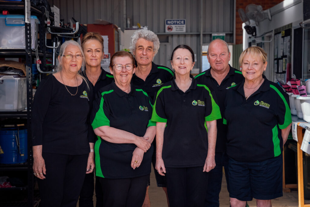 seven Green Clean Team staff members standing in a depot space in Bendigo Central Victoria