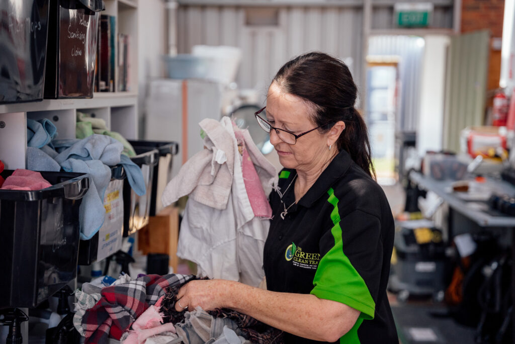 Green Clean Team staff member sorting eco-friendly cleaning cloths at our Bendigo depot in Central Victoria